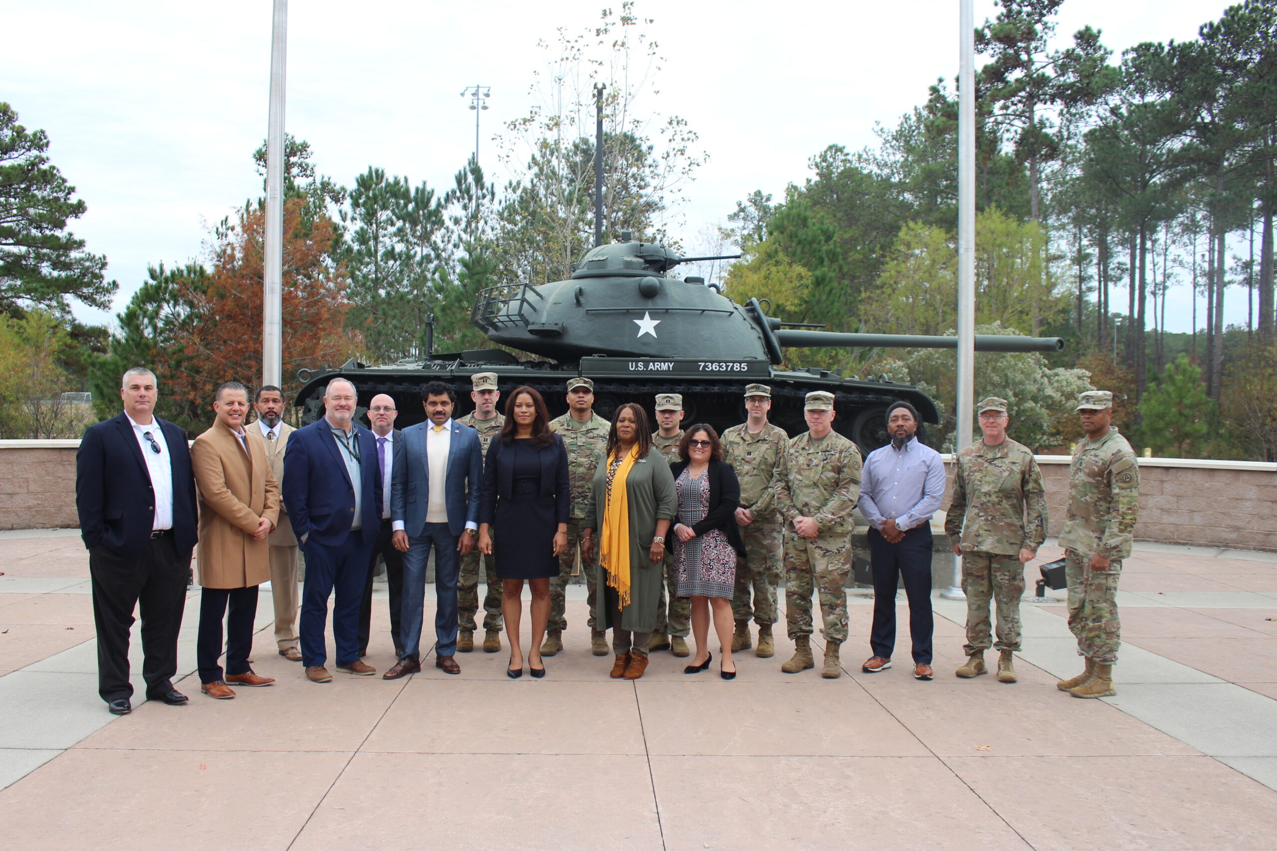 OSC Edge, Business Integra, ARCENT officials at ribbon cutting ceremony, in front of Army tank